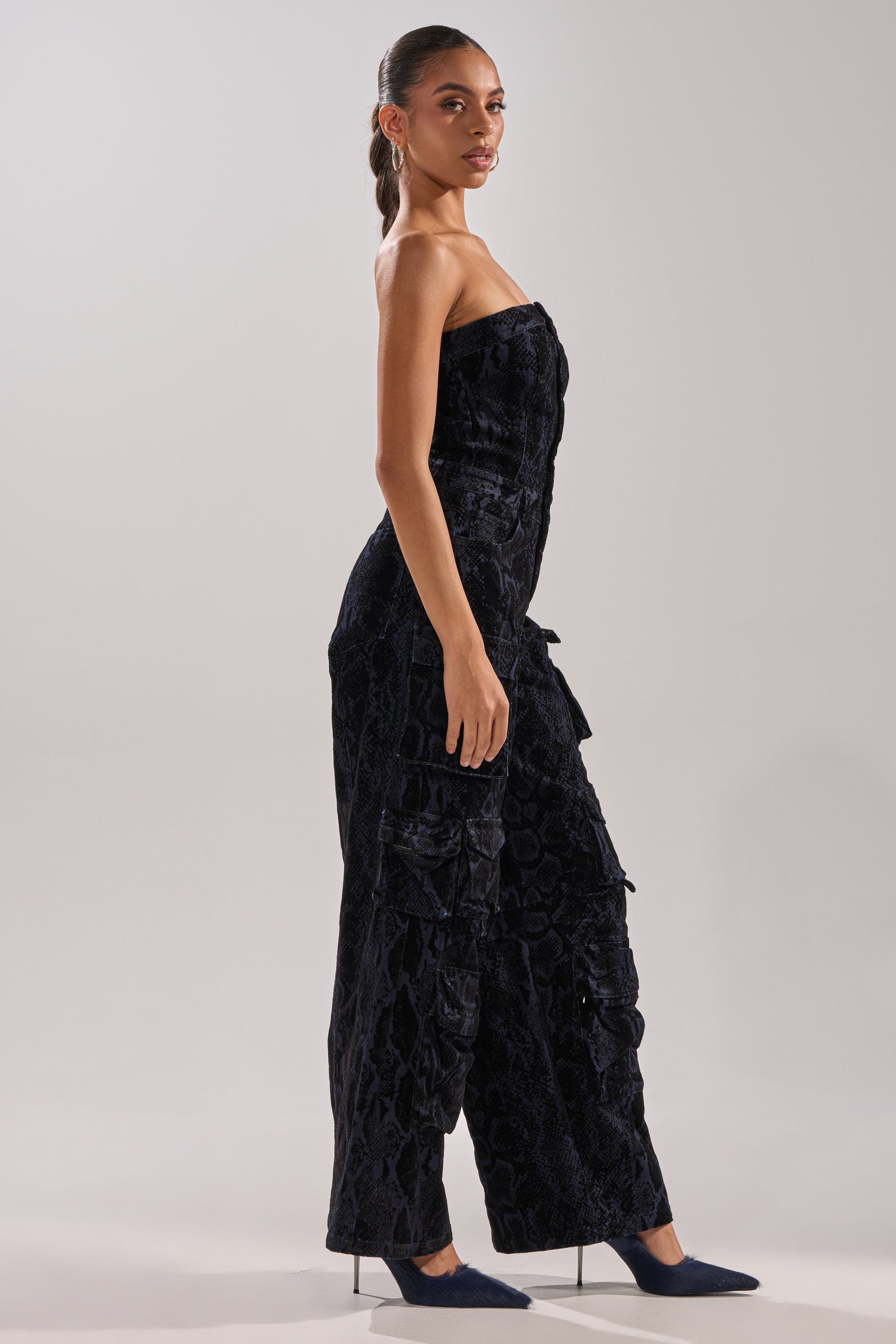 CAUGHT YOUR EYE VELVET DENIM JUMPSUIT IN SNAKEPRINT
