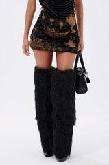 DONT THINK ABOUT IT COW PRINT MINI SKIRT IN BROWN