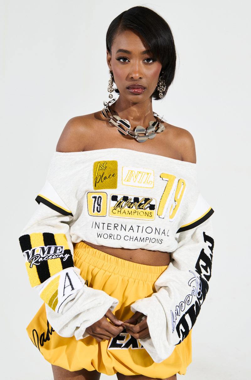 RACING THROUGH OFF THE SHOULDER SWEATSHIRT